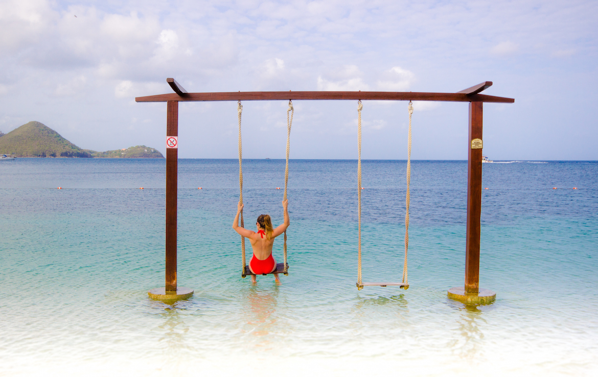 Swings over the water at Sandals Grande St. Lucian.